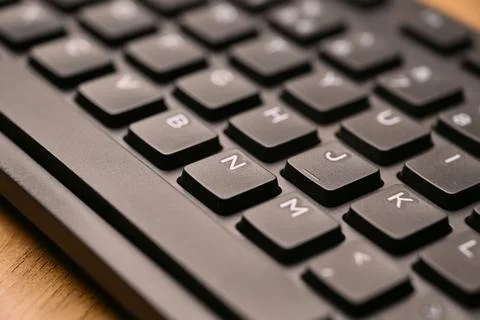 Side Angled Top View Macro Close-Up Black Computer Keyboard Highlighting N .. Stock Photos