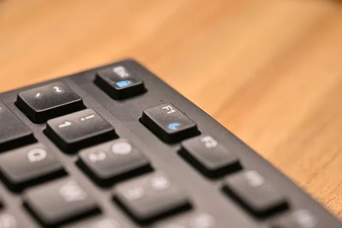 Side Angled Top View Macro Close-Up Black Computer Keyboard Highlighting F1.. Stock Photos
