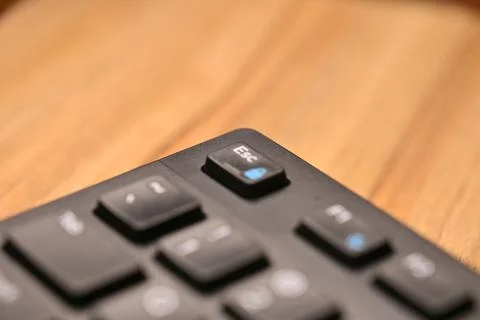 Side Angled Top View Macro Close-Up Black Computer Keyboard Highlighting Es.. Stock Photos