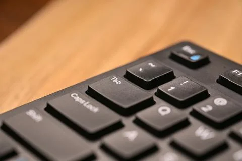 Side Angled Top View Macro Close-Up Black Computer Keyboard Highlighting Ta.. Stock Photos