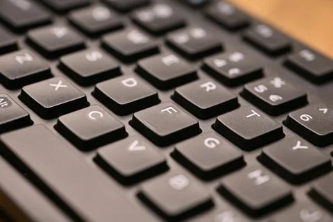 Side Angled Top View Macro Close-Up Black Computer Keyboard Highlighting F .. Stockfoto's