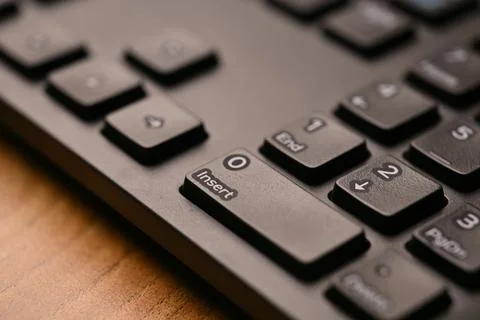 Side Angled Top View Macro Close-Up Black Keyboard Highlighting Zero and In.. Stock Photos