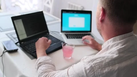 Side back view caucasian man in light shirt hands writing code on laptop. Stock Footage 245184262