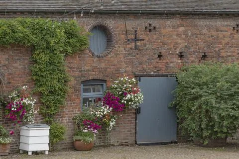 The side of a barn with round window Stock Photos