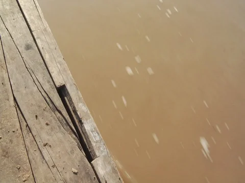 Side of Boat on Muddy River in Amazon Jungle Rainforest Stock Footage 112943216