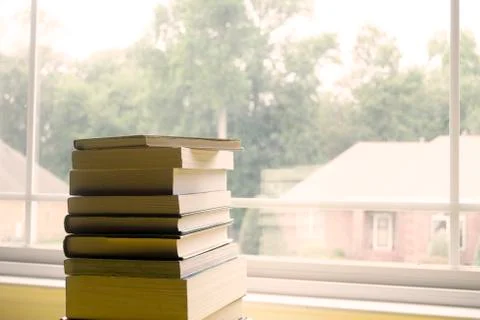 Side of Books in Front of Window Foto stock