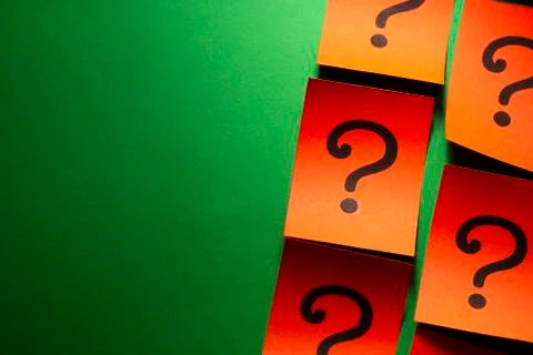 Side border of red cards with question marks Stock Photos