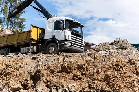 Side bottom pov big modern truck with mounted self loading crane arm boom Stock Photos