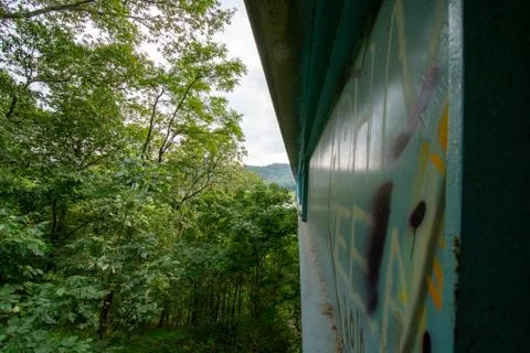 The Side of a Bridge Covered in Graffiti Stock Photos