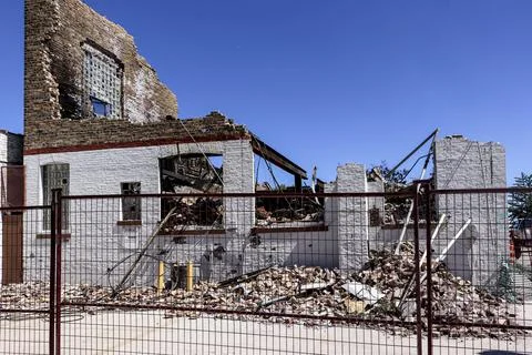Side of broken down building Stock Photos