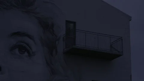 Side of building with art work of woman's face Reykjavik, Iceland Stock Footage 74167982