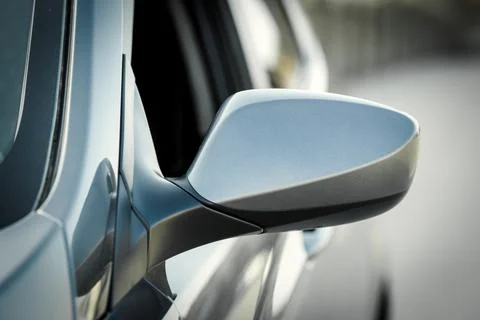 Side car mirror close-up. Back view of mirror of silver car Stock Photos