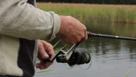 Side close-up of equipment and hands of unrecognizable man fly fishing. Fis.. Video stock 277847911