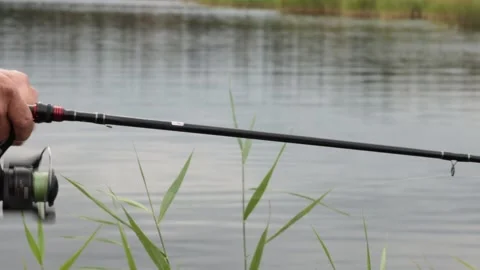 Side close-up of equipment and hands of unrecognizable man fly fishing. Fis.. Video stock 277847920