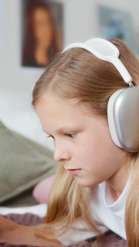 Side close-up of girl drawing on tablet with stylus Stock Footage 313048902