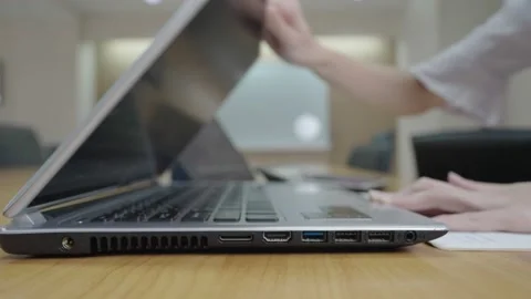 Side Close Up of a hands of employee working on computer laptop Stock Footage 167472814