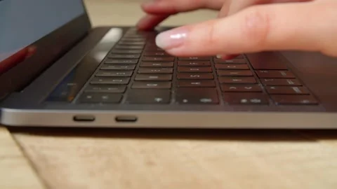 Side Close Up of Hands typing Text on a Laptop/Notebook  Stock Footage 132171059