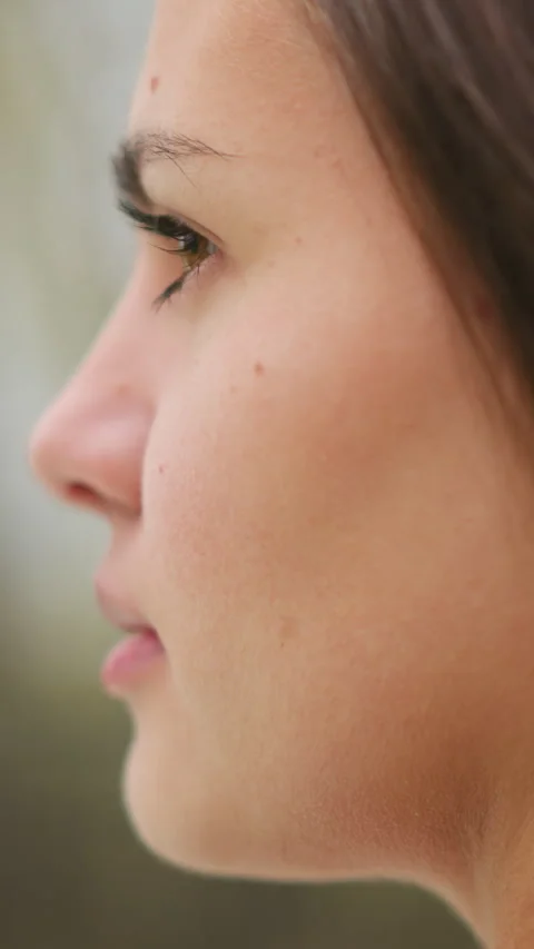Side close-up lady face with goosebumps showing emotional response and skin Stock Footage 318569934