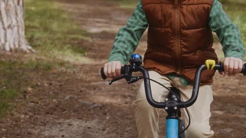 Side close view boy cycling self confidence growth Stock Footage 317554431