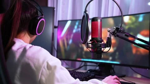A side close-up view of a pretty nice girl gamer streaming online videogames  Stock Footage 155278220