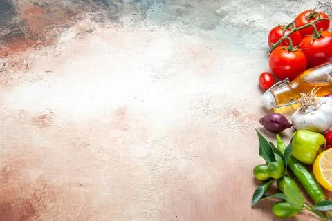 Side close-up view vegetables lemon oil onion garlic bell peppers tomatoes .. Stockfoto's