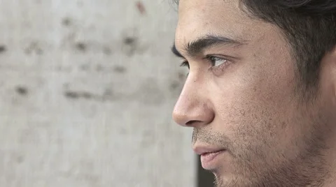 Side closeup portrait of a pensive man in the city Stock Footage 66672162
