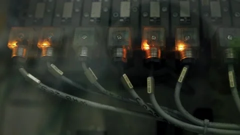 Side closeup view of glowing indicators of server hardware Stock Footage 308715645