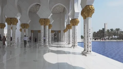Side Colonnade Walkway with Gold Columns at Sheikh Zayed Mosque Stock Footage 327330546