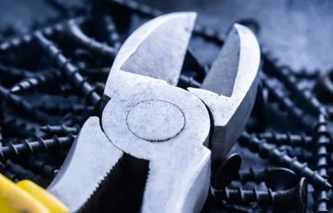 Side cutter on screws Stock Photos