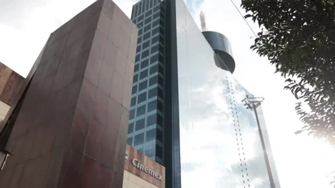 Side diagonal low-angle shot of Mexico City's World Trade Center with sunset. Video stock 158779182