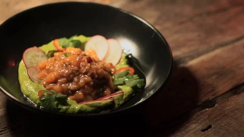 Side dish: fish tartar with green sauce, vegetables and greens in ceramic plate  Vídeo Stock 107777909