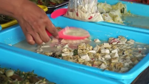 A side dish seller typical of South Kalimantan Stock Footage 208311318