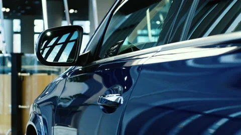 Side door windows and rearview mirror of a new SUV from a premium car brand.  Stock Footage 144863284