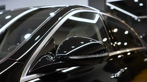 Side door windows and rearview mirror of a new a premium car brand. Sale of new Video stock 232753847