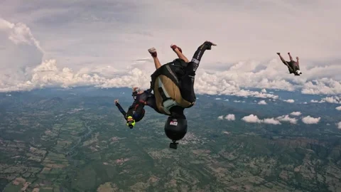 Up side down parachutists falling in the air in  South America Video stock 259027923