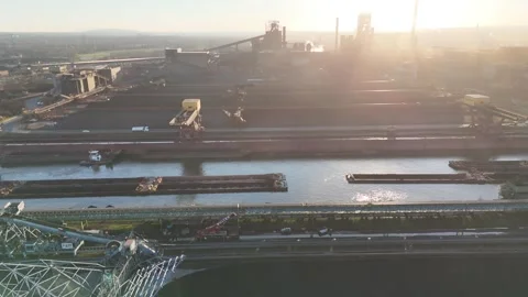 Side drift over coal mound and hazy harbor basin Stock Footage 331204130