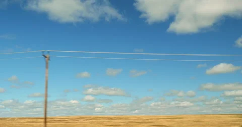Side driving plate on the highway through plains mid America farm land Stock Footage 287486964