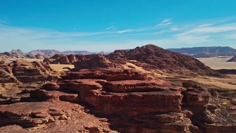 Side drone around rocky mountains in wadi rum desert in jordan Vídeo Stock 332986653