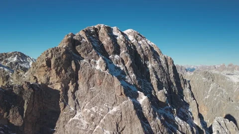 Side Drone Flight Along Rocky Alpine Peaks in the Cadore Dolomites, Italy Stock Footage 335793416