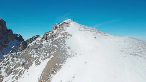 Side Drone Flight Along Snowy Peak in San Pellegrino Stock Footage 335966609