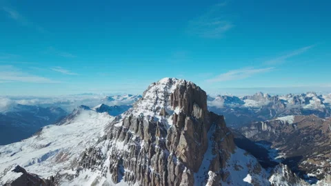 Side Drone Flight Around Snowy Peak in San Pellegrino Stock Footage 336255418