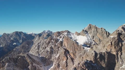 Side Drone Flight Over Rocky Alpine Ridges in the Cadore Dolomites, Italy Stock Footage 335777447