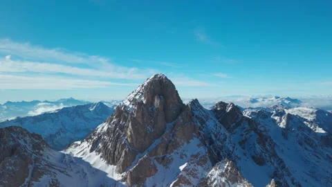 Side Drone Orbit Around Rocky Snowy Peak in San Pellegrino Stock Footage 335924515