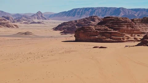Side Drone over sandy desert with big rocky mountains in wadi rum in jordan 库存影片 332987156