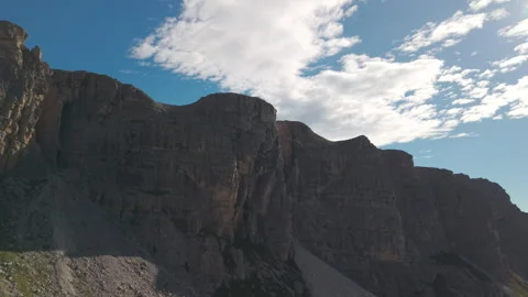 Side Drone Tilt Up Along Lastoi de Formin Cliffs Stock Footage 336862509