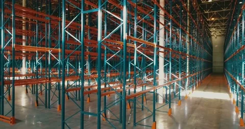 Side drone view inside warehouse. Rows of metallic frameworks. Camera going up Stock Footage 135056928