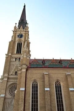 Side facade and The bell, clock tower of the Name of Mary Church with its c.. Stock Photos