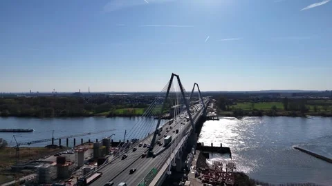 Side flight across bridge towers and traffic lanes Stock Footage 331200656