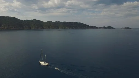 Side fly view of a moving yacht in Kekova Bay. Turkey. DJI-0294-12 Stock Footage 102485260