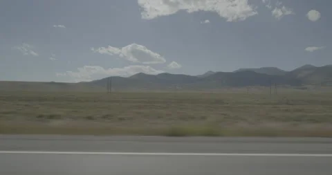 Side left driving plate - Highway 285 at Mile 109 Saguache County Vídeos de archivo 288893033